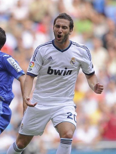 Real Madrid's Argentinian forward Gonzalo Higuain celebrates after scoring a goal